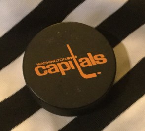 hockey puck and stripes